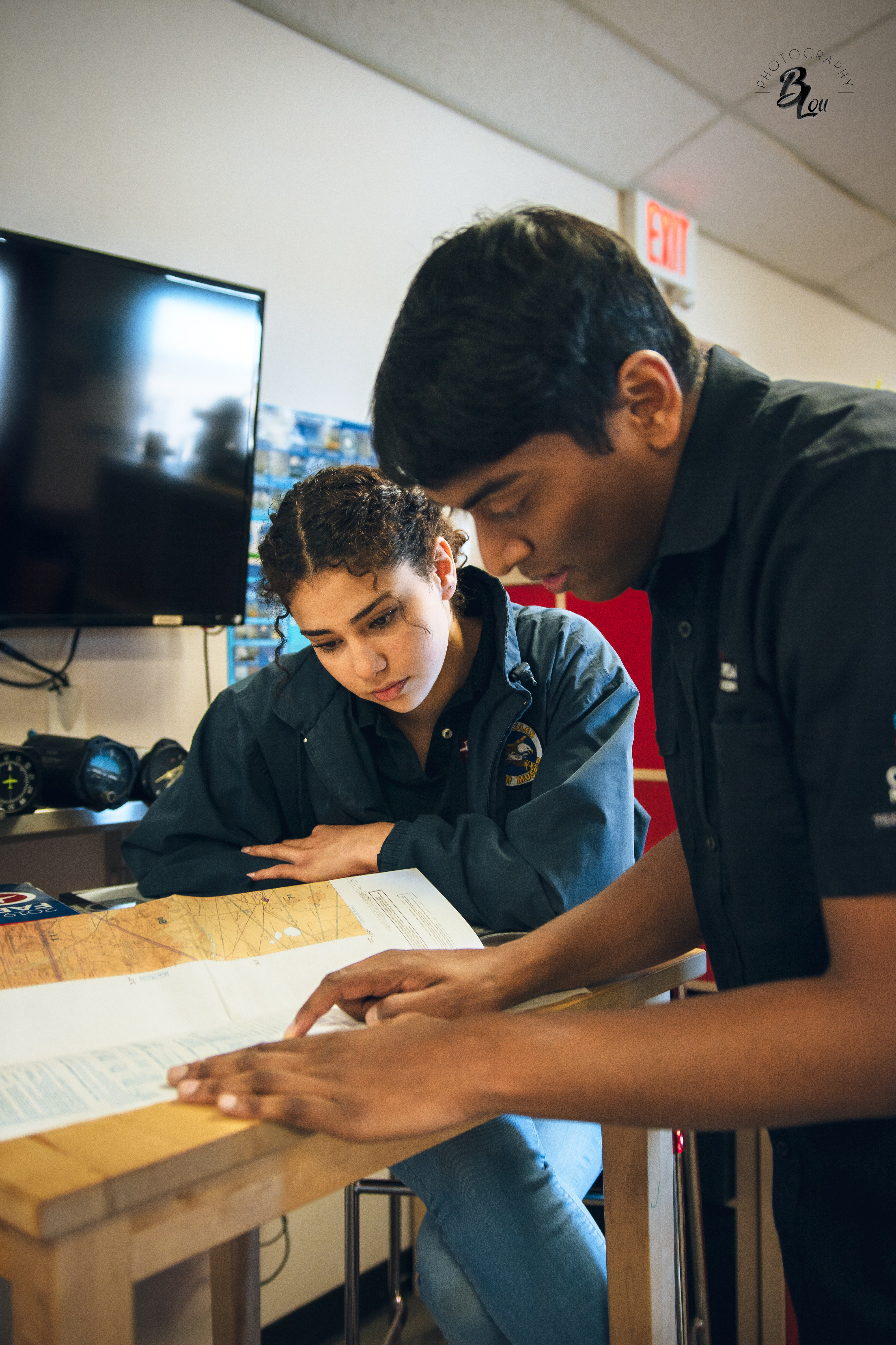 Dispatch Manager Jazmine Anaya and CFII Shihran Pathy reviewing their material