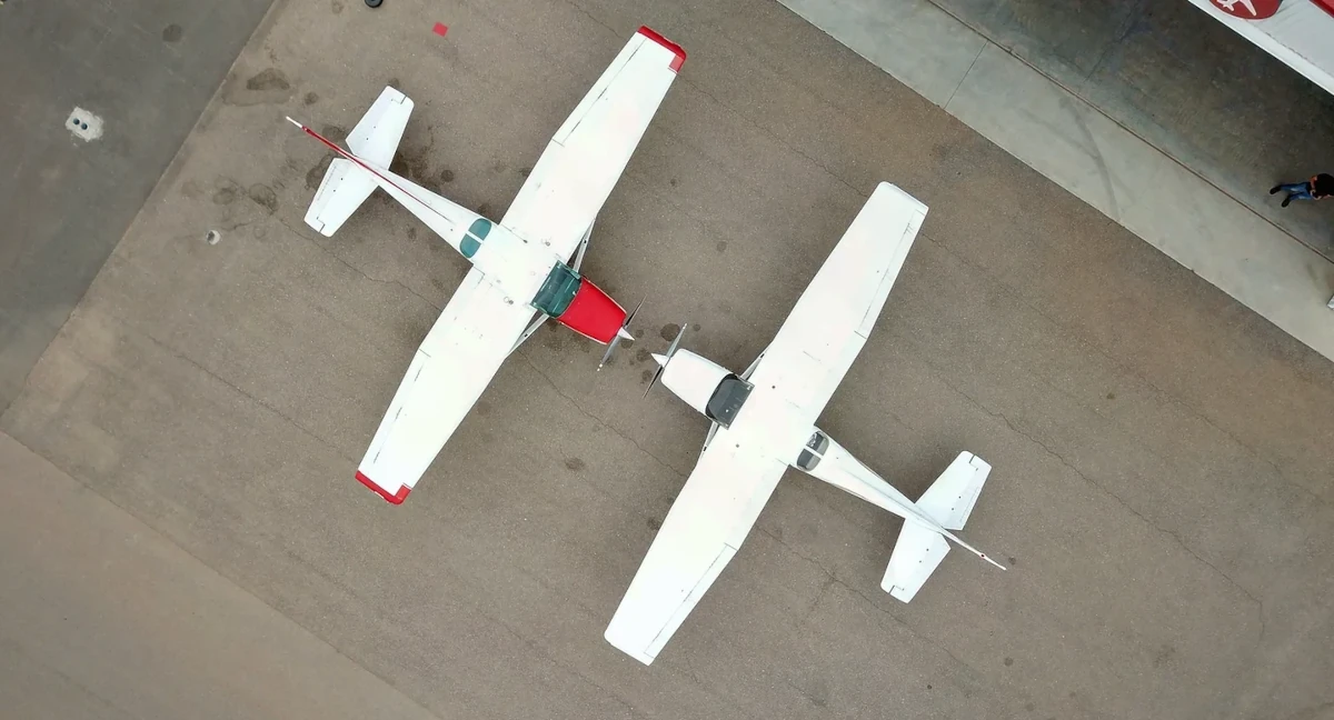 CFI gazes into the rotating propellers of a Cessna 172 at Red Arrow Flight Academy